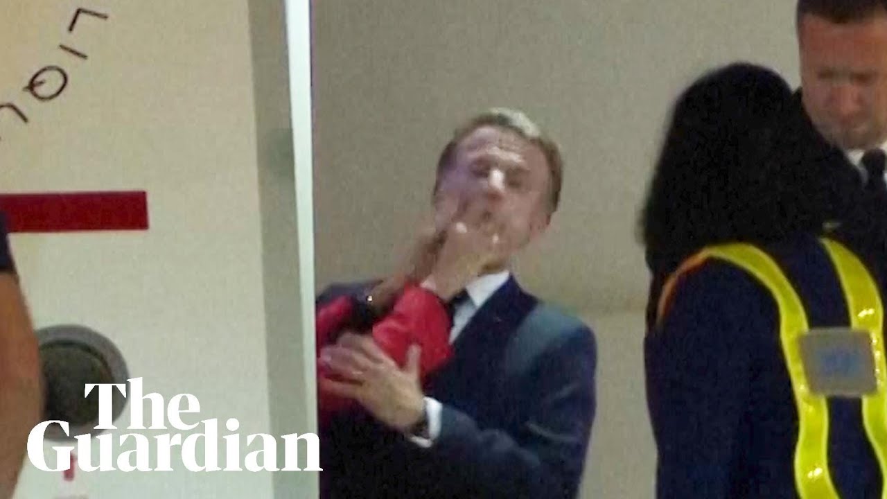 Moment Macron's wife pushed him in the face as they land in Vietnam